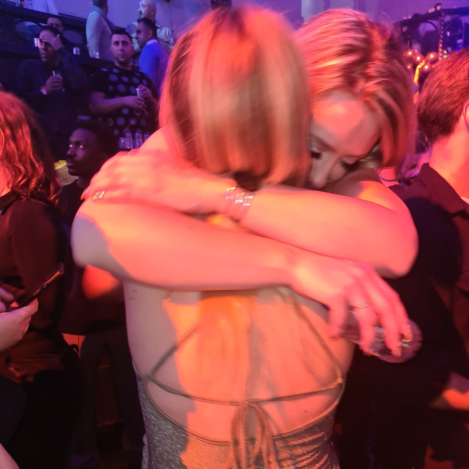 embrace of two blond ladies